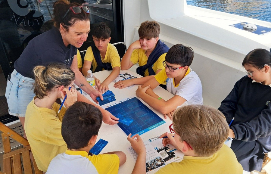 Kids in an activity on a boat
